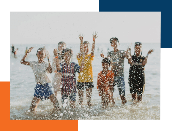 Children having fun by the beach, linked to our Program helping missionaries with their finances