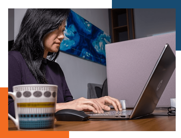 A member of our team, researching international travel medical insurance on the computer.