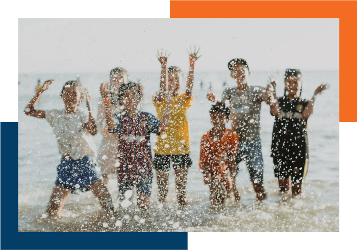 Children having fun by the beach, linked to our Program helping missionaries with their finances