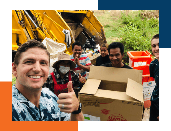 Missionary working with the locals to clean up the community